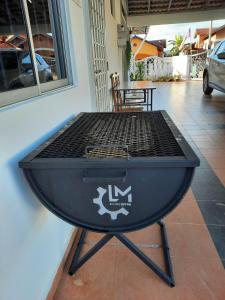 a grill sitting on a table outside a building at Beit Azzahra in Kuantan