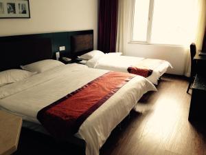 Ein Bett oder Betten in einem Zimmer der Unterkunft Super 8 Beijing Chaoyang Road Xinglong