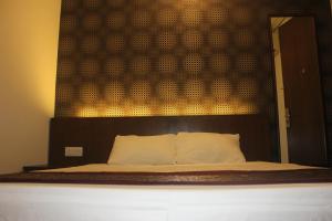 Ein Bett oder Betten in einem Zimmer der Unterkunft KF Guesthouse