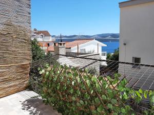 a view from the balcony of a house with a fence at Oaza in Komarna