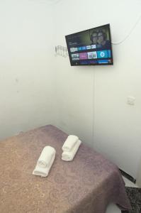 Posteľ alebo postele v izbe v ubytovaní Habitación en el corazón del centro de Malaga