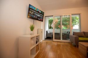Televízia a/alebo spoločenská miestnosť v ubytovaní Appartements in Graz beim LKH
