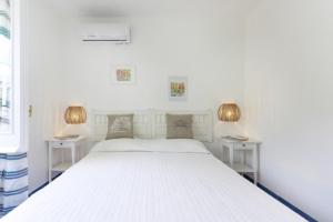 Giường trong phòng chung tại sole chiaro home