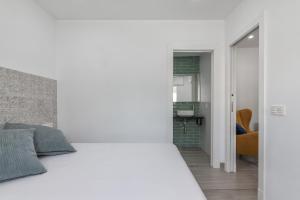 Кровать или кровати в номере Casa Gato