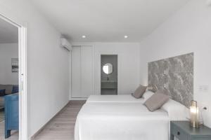 Кровать или кровати в номере Casa Gato
