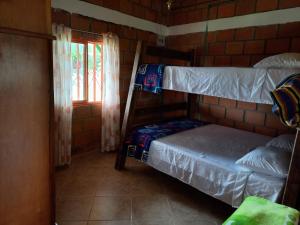 Bunk bed o mga bunk bed sa kuwarto sa Finca Villa Gabriela
