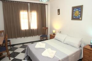 Posteľ alebo postele v izbe v ubytovaní Habitación en el corazón del centro de Malaga