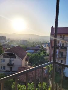 a view of a city from a balcony at Homelike B&B in Tbilisi City