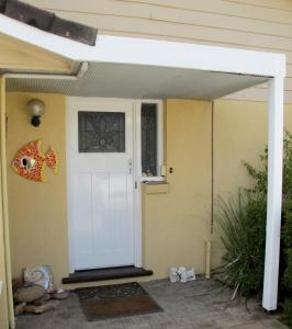 a door to a house with a white door at Layton Street Apartments in Esperance