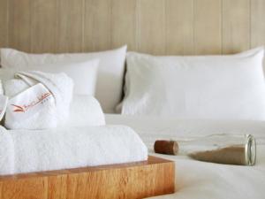 Postel nebo postele na pokoji v ubytování Bari Lamai Resort