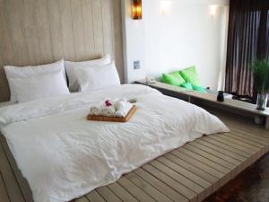 Postel nebo postele na pokoji v ubytování Bari Lamai Resort