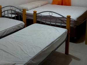 Tempat tidur dalam kamar di Conforto com aconchego e paz
