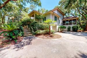 a house with a driveway in front of it at 43 Trumpet Creeper in Kiawah Island