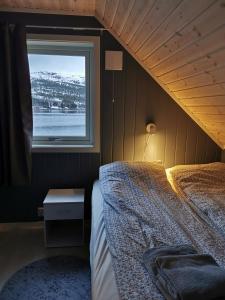 En eller flere senger på et rom på Senja arctic lodge
