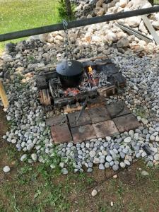 a pot on a stove in a pile of rocks at House in forest in Žabljak