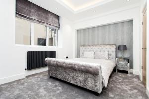 En eller flere senger på et rom på Luxury Escapes @ London Victoria
