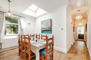 a dining room with a table and chairs at 8 Kents Bank House in Grange