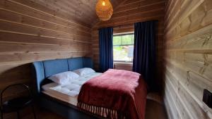 Postel nebo postele na pokoji v ubytování Mlodge - The Mountain Lodge
