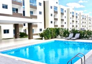 Bello y comodo apartment , residencial con piscina, seguridad las 24 Horas 내부 또는 인근 수영장