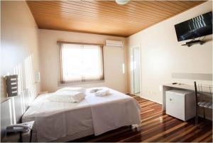 Ένα ή περισσότερα κρεβάτια σε δωμάτιο στο HOTEL MARTELLO