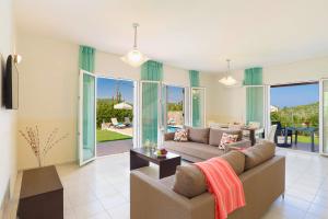 A seating area at Villa Apollo Springs by Villa Plus