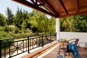 A balcony or terrace at Villa Olympios Springs by Villa Plus