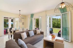 A seating area at Villa Athena Springs by Villa Plus