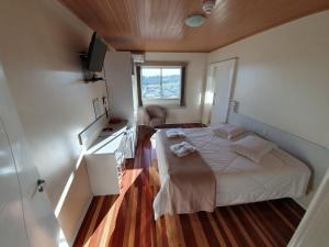 Ένα ή περισσότερα κρεβάτια σε δωμάτιο στο HOTEL MARTELLO