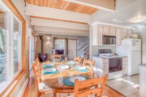 a kitchen and dining room with a table and chairs at 38445 Reed - Meredith Lodging in Manzanita +41 photos
