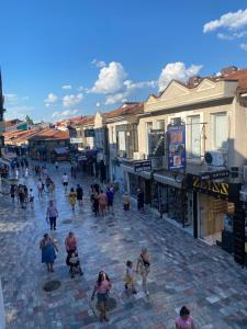 a group of people walking down a street at Galeb Apartment Ohrid in Ohrid