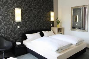 Ліжко або ліжка в номері Hotel Heidelberger Hof