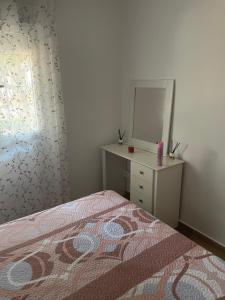 A bed or beds in a room at Apartamento Torrelaguna