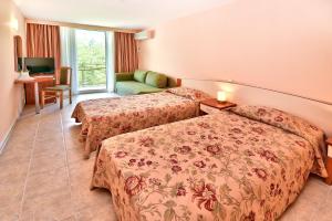 Ένα ή περισσότερα κρεβάτια σε δωμάτιο στο Hotel Malibu +55 φωτογραφίες