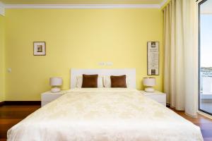 Postelja oz. postelje v sobi nastanitve Porto de Mos Golf & Beach B&B AL-40312