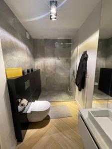 Koupelna v ubytování Luksusowy Apartament na Wydmach Międzywodzie + 10 fotografií