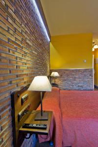 Postel nebo postele na pokoji v ubytování Hotel Doña Blanca