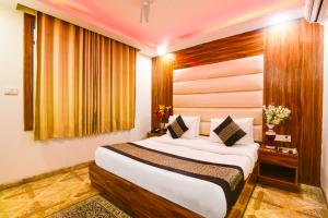 Postel nebo postele na pokoji v ubytování Olivia Hotels At Delhi Airport