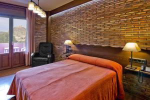 Postel nebo postele na pokoji v ubytování Hotel Doña Blanca