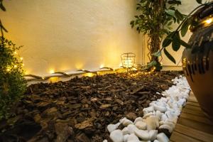 a rock garden with teddy bears and lights at Le Work&Play - Logement spécial séminaires, vacances, repas. in Clermont-lʼHérault
