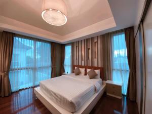 מיטה או מיטות בחדר ב-Malibu Pool Villa Pattaya