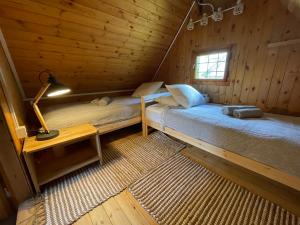 A bed or beds in a room at Chalet Hike&Bike above Bohinj valley