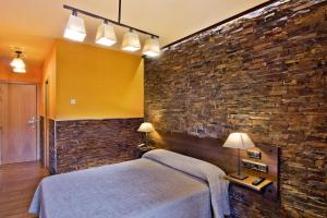 Postel nebo postele na pokoji v ubytování Hotel Doña Blanca