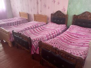 Ένα ή περισσότερα κρεβάτια σε δωμάτιο στο Gunter Guest house