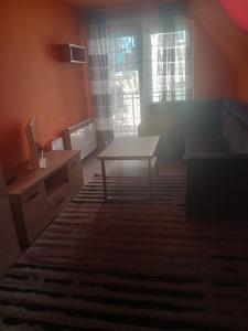 Χώρος καθιστικού στο Uroczy apartament