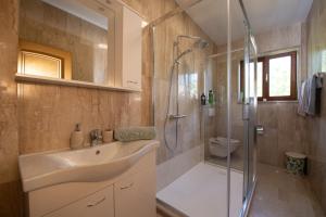 a bathroom with a sink and a shower at Bela Vista 4 Rustikales Appartement in Volosko +71 photos