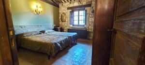 Cama o camas de una habitación en Castell de Llaés