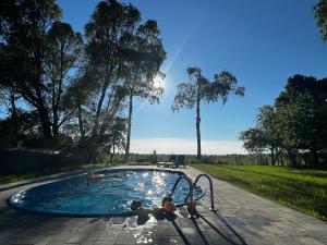 a small pool with a person on a slide at Black Horse in Pasłęk