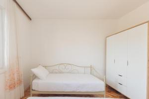 Łóżko lub łóżka w pokoju w obiekcie Buena Vida Apartman