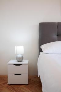 Łóżko lub łóżka w pokoju w obiekcie Buena Vida Apartman