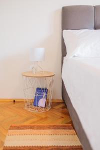 Łóżko lub łóżka w pokoju w obiekcie Buena Vida Apartman